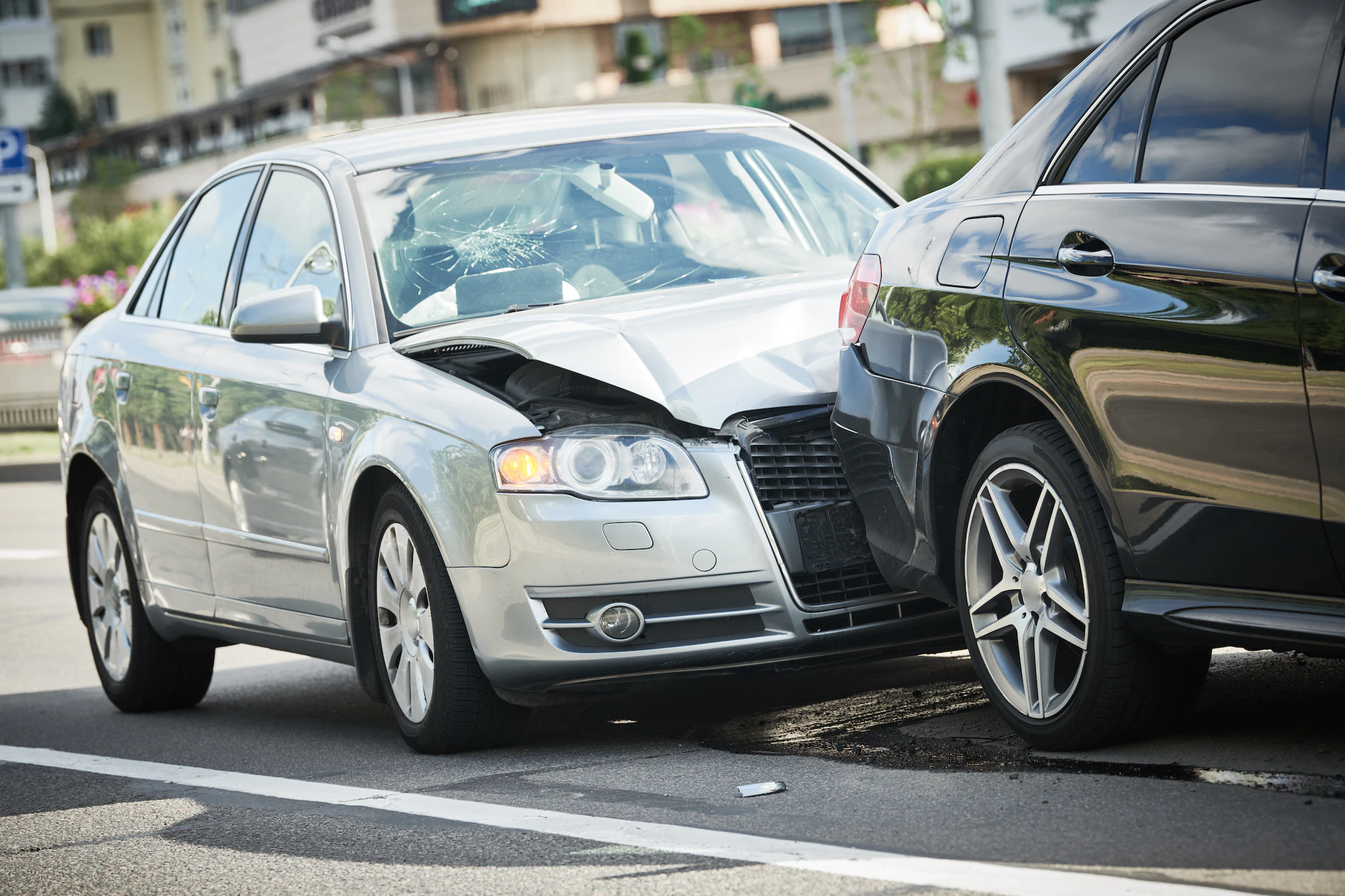 car crash accident on street. damaged automobiles car crash accident. Car collision on city street. Two damaged automobiles