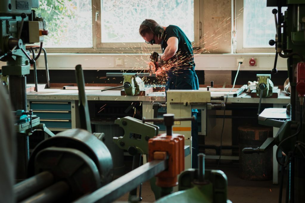 man working with pneumatic impact tools - construction