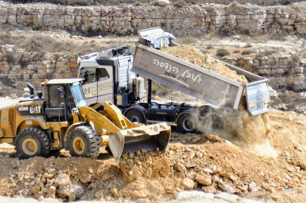 dump truck tipping on construction site