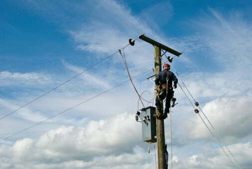 man working on electrical wires in construction industry