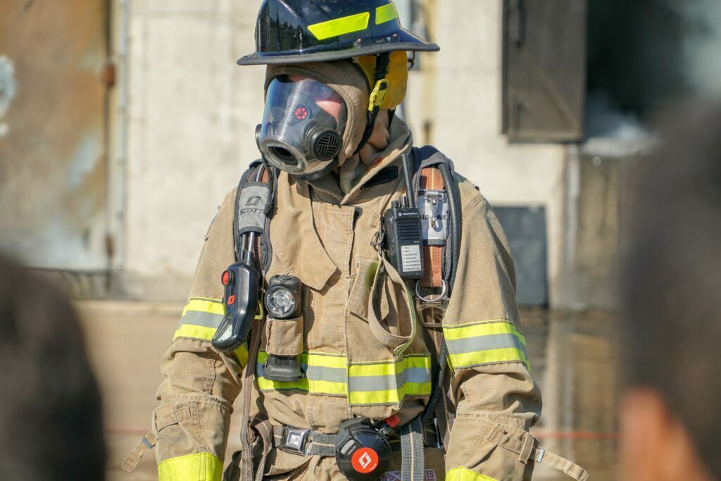 NYC firefighter with mask on to protect against toxic fumes