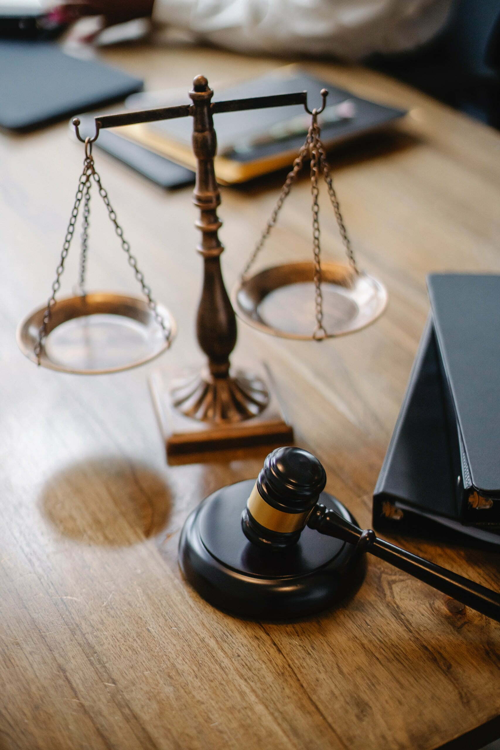 gavel and scale on desk in law office of sexual abuse case.