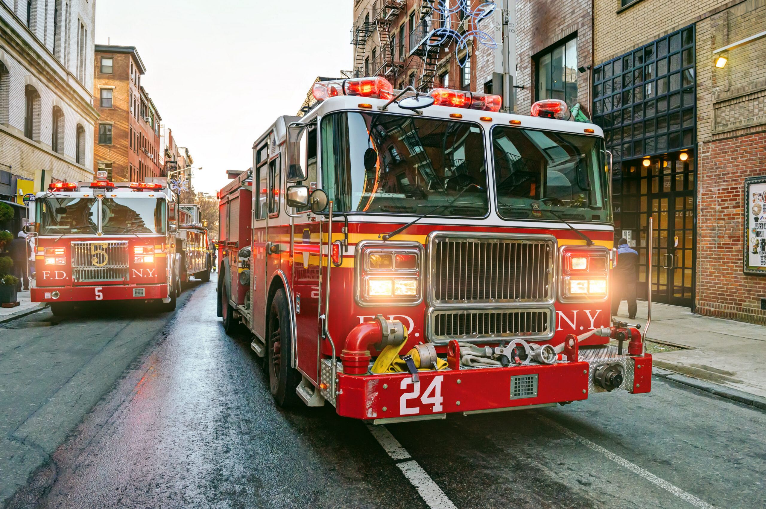 New York fire trucks Fire engines driving on the streets of Manhattan, New York