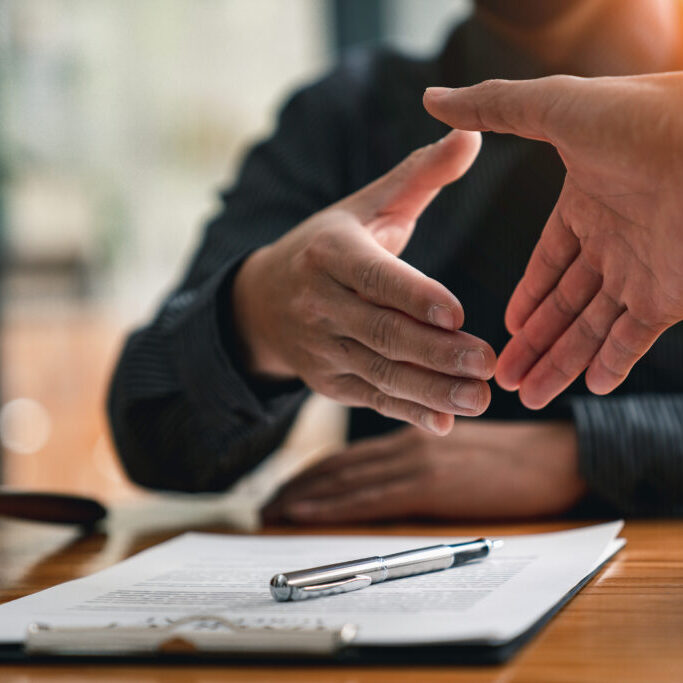 Lawyers shake hands with business people to seal a deal with par Lawyers shake hands with business people to seal a deal with partner lawyers. or a lawyer discussing contract agreements, handshake concepts, agreements, agreements